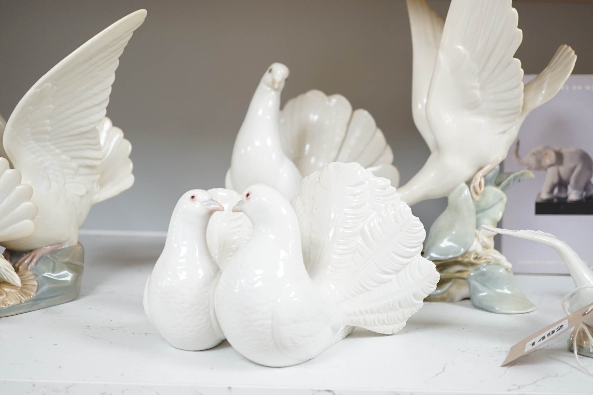 Fourteen Lladro models to include nine various animals and five birds (all boxed), largest 29cm high. Condition - good